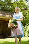 Woman with basket of fresh vegetables