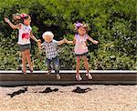 Children jumping together in park