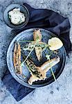 Plate of fried fish with lemon