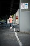 Woman running on city street