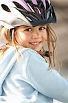 Girl wearing bike helmet outdoors