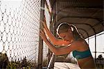 Woman stretching on urban footbridge