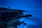 Lighthouse overlooking rocky beach