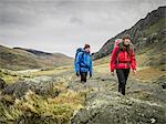 Couple hiking in rocky landscape