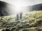 Couple hiking in rocky landscape