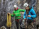 Rock climbers organizing equipment