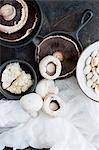 Pots of mushrooms with muslin