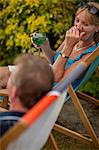 Couple having wine together outdoors