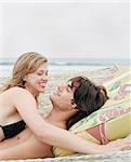 Couple laying on beach together