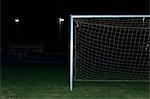 Soccer goal in field at night