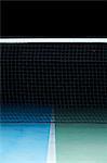 Tennis net on court at night