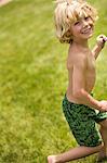 Smiling boy playing in backyard