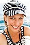 Woman wearing nautical hat and shirt