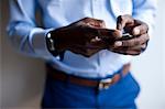 Close up of businessman using cell phone