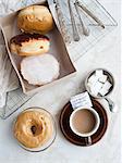 Cup of coffee with donuts and sugar