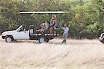 Young people on safari in off road vehicle, Stellenbosch, South Africa