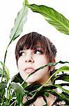 Portrait of a young woman in a plant