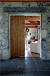 Woman walking in modern home interior