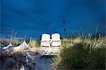 Illuminated beach chairs on sand dune, Baltic Sea, Germany