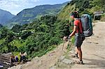 Female trekker looking at view, Bahundanda, Nepal