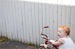Baby girl pushing tricycle