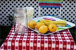 Fresh lemons and paper cups for selling homemade lemonade
