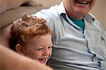 Boy laughing with grandfather