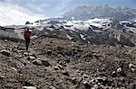 Woman descends the Horcones Valley from Plaza de Mulas on Aconcagua in the Andes Mountains, Mendoza Province, Argentina