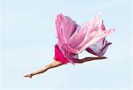 Ballerina jumping with fabric side view