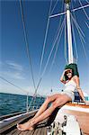 Young woman on deck of yacht