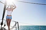 Young woman on yacht  wearing shorts