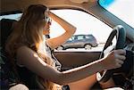 Young woman driving car