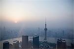 Oriental Pearl Tower and Huangpu River over misty cityscape, Shanghai, China