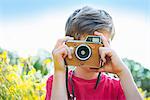 Boy taking photograph