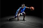 Studio shot of basketball player holding ball