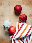 Peaches and dish towel, overhead view