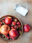 Basket of apple, peaches and strawberries, overhead view