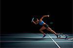 Young female athlete in relay race