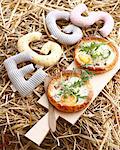 Still life of fresh pancetta tarts with rocket garnish