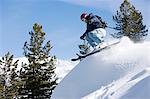 Male skier jumping on mountain