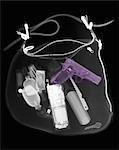 X-ray of a woman's handbag with gun