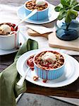 Still life of rhubarb, apple and strawberry crumble with ice cream