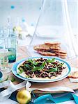 Plate of minced lamb and chickpea with herb garnish