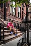 Woman sitting on steps