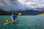 Female kayaker on St. Mary Lake, Glacier National Park, Montana, USA