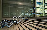 Illuminated wavy lines moving up office building steps