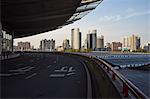 Shanghai south train station in front of city skyline, Shanghai, China