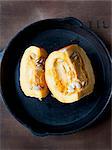 Still life of sliced pumpkin in skillet