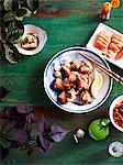 Still life plate of karaage chicken with tofu, pickled ginger and lemon