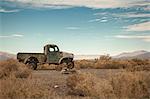 Abandoned truck in desert landscape, Trona, California, USA